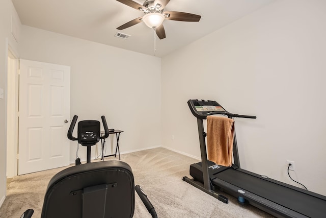 workout room with carpet floors, baseboards, visible vents, and a ceiling fan