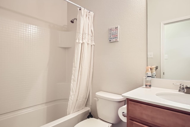 bathroom featuring toilet, shower / bath combo, and vanity