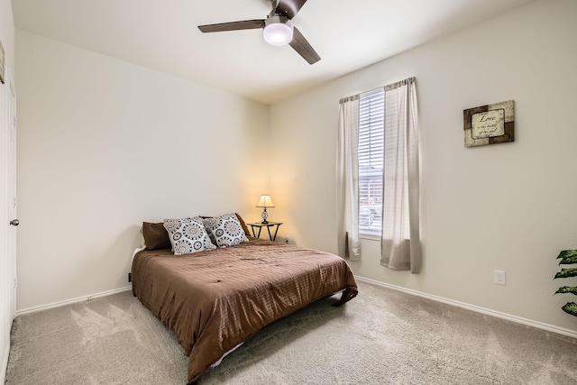 bedroom with carpet, ceiling fan, and baseboards