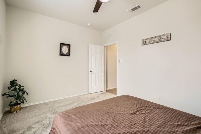 bedroom with ceiling fan, carpet flooring, visible vents, and baseboards