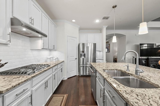 kitchen featuring under cabinet range hood, a sink, visible vents, white cabinets, and appliances with stainless steel finishes