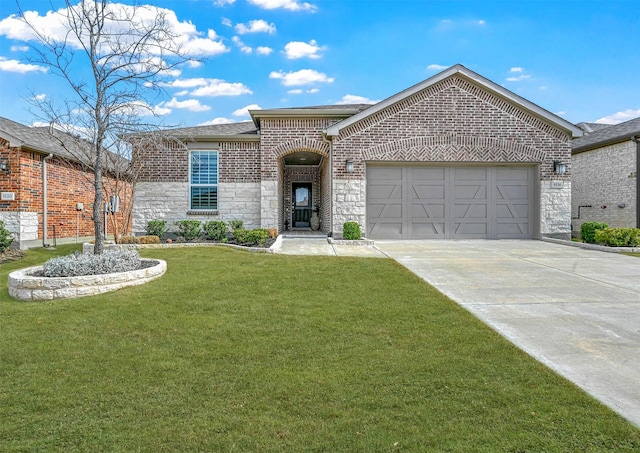 view of front of home featuring driveway, stone siding, an attached garage, a front yard, and brick siding