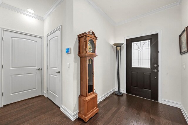 entryway featuring baseboards, ornamental molding, and dark wood finished floors