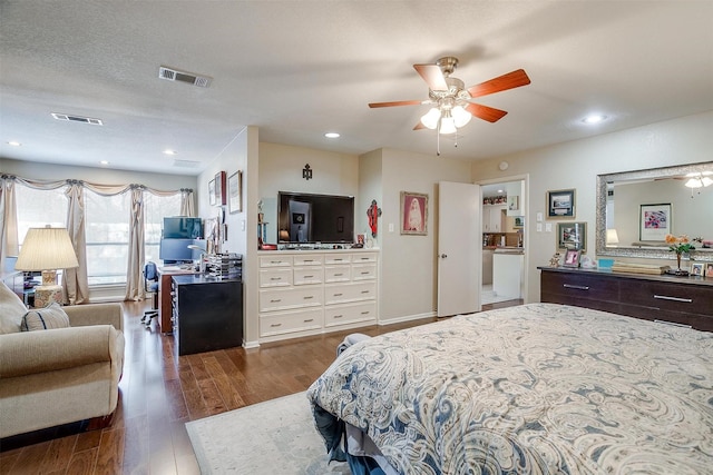 bedroom with recessed lighting, visible vents, and wood finished floors