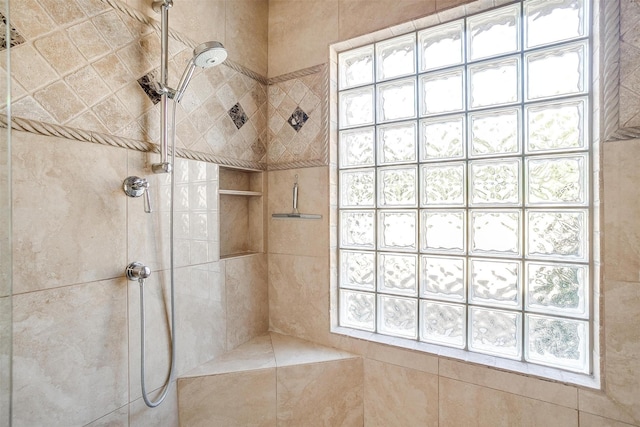 full bath featuring tiled shower