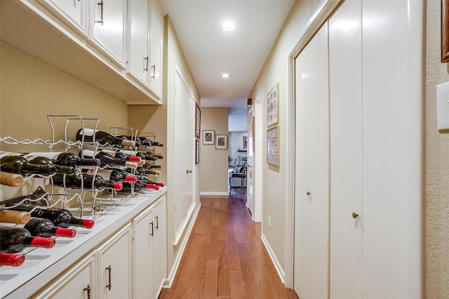 interior space with recessed lighting, light wood-style flooring, and baseboards