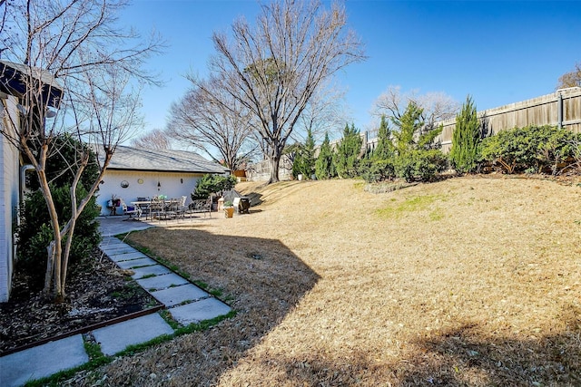 view of yard featuring a patio area and fence