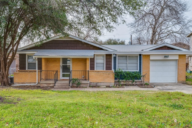 ranch-style home featuring a front lawn, covered porch, brick siding, and an attached garage