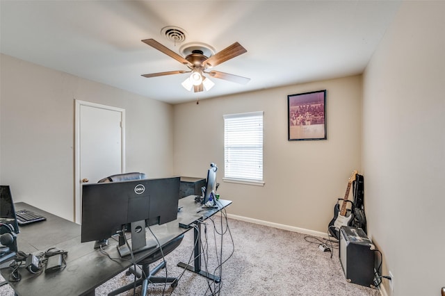 office space featuring ceiling fan, carpet floors, visible vents, and baseboards