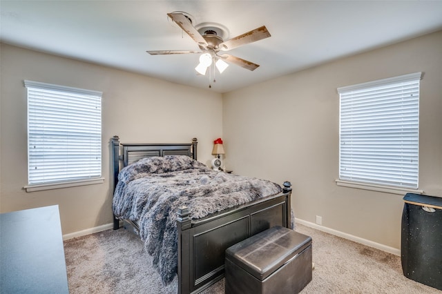 bedroom with baseboards, ceiling fan, and light colored carpet