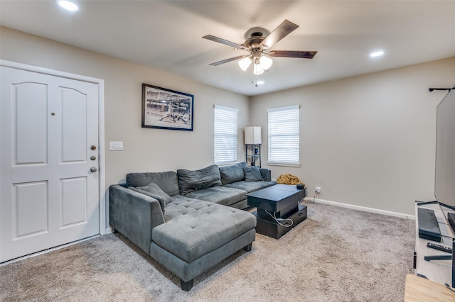 carpeted living area with recessed lighting, ceiling fan, and baseboards