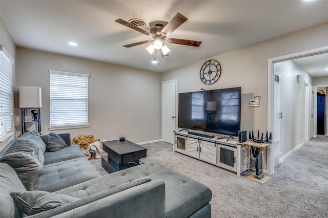 carpeted living area with ceiling fan, visible vents, baseboards, and recessed lighting