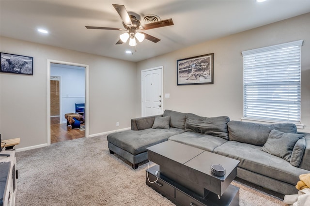 living area with carpet floors, recessed lighting, a ceiling fan, and baseboards