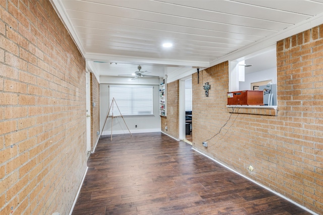 garage featuring ceiling fan and baseboards