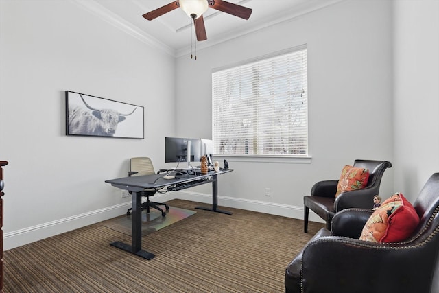 office space with carpet flooring, a ceiling fan, baseboards, and ornamental molding