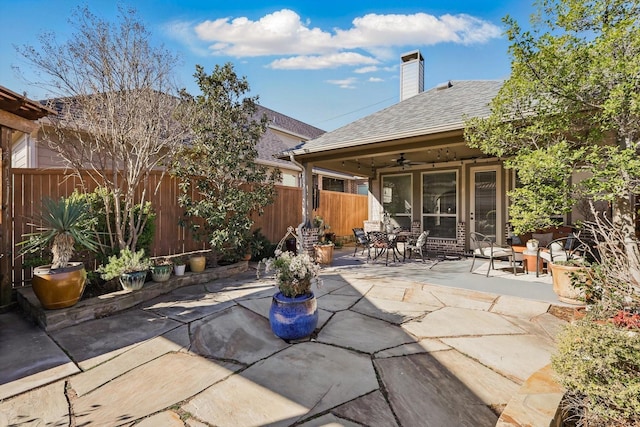 view of patio / terrace with outdoor dining space, ceiling fan, and a fenced backyard