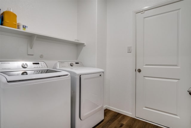 washroom with laundry area, separate washer and dryer, and dark wood finished floors