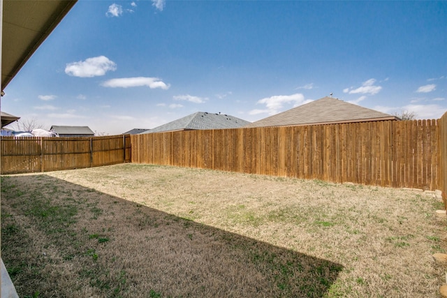 view of yard with a fenced backyard