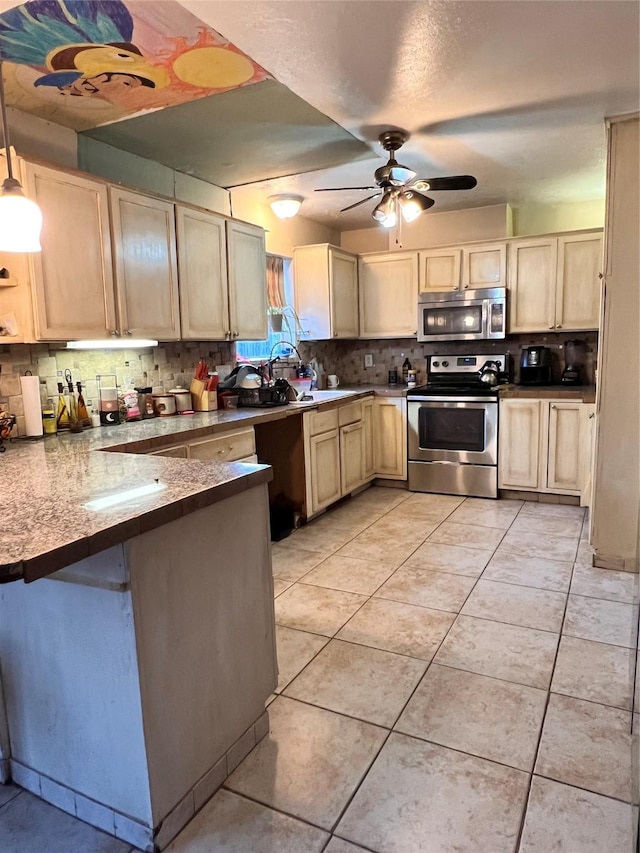 kitchen featuring tasteful backsplash, appliances with stainless steel finishes, light tile patterned flooring, light brown cabinets, and a peninsula