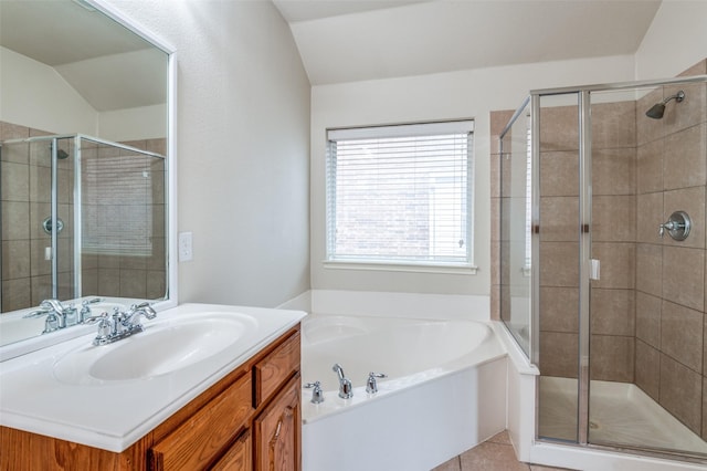 full bath with vanity, tile patterned floors, a bath, and a stall shower