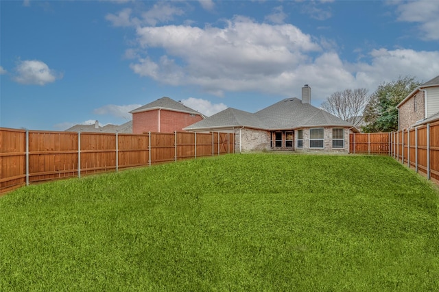 view of yard featuring a fenced backyard