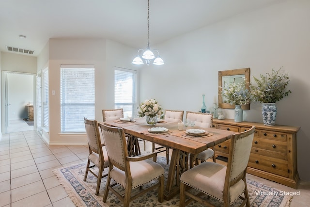 13356 Four Willows Dr, Frisco, TX 75035 - dining space with baseboards, a notable chandelier, light tile patterned flooring, and visible vents