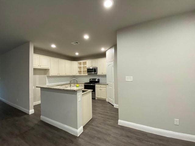 kitchen featuring stainless steel appliances, recessed lighting, visible vents, decorative backsplash, and dark wood-type flooring