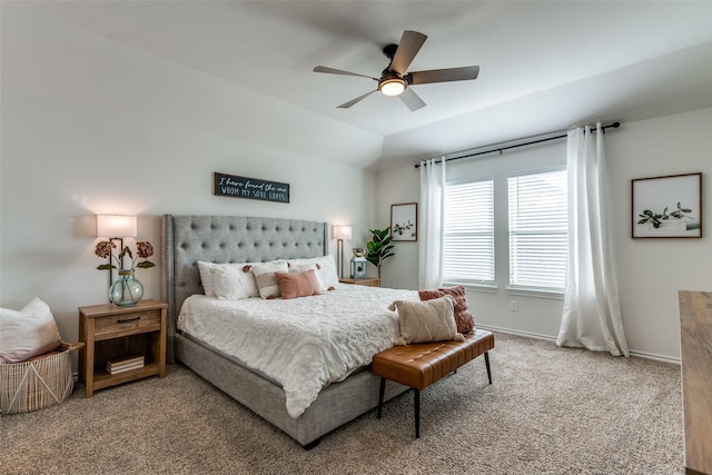 carpeted bedroom with lofted ceiling, ceiling fan, and baseboards