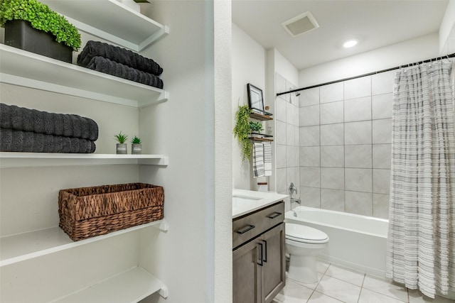 bathroom with toilet, shower / tub combo, vanity, visible vents, and tile patterned floors