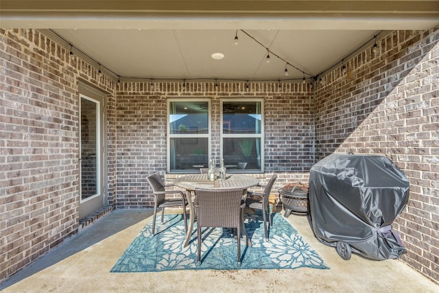 view of patio featuring outdoor dining area and grilling area