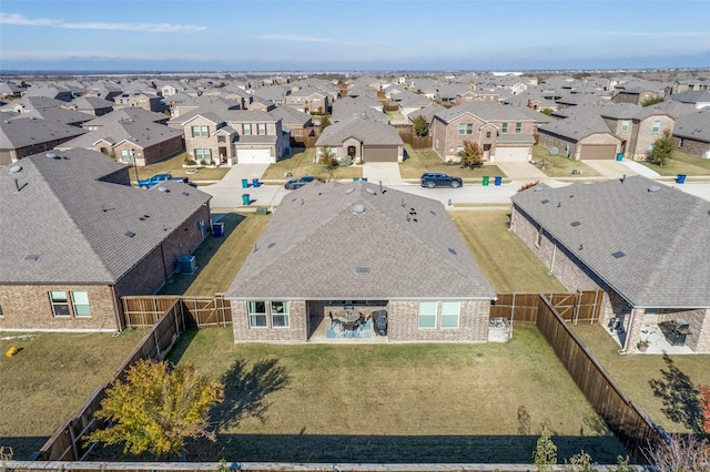 birds eye view of property with a residential view