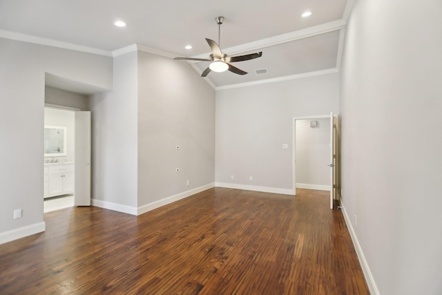 empty room with ornamental molding, dark wood-style flooring, ceiling fan, and baseboards