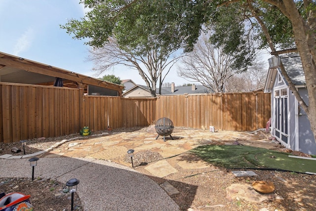 view of patio / terrace featuring a fire pit and a fenced backyard