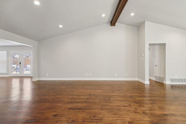 unfurnished living room with lofted ceiling with beams, dark wood-style floors, visible vents, and baseboards