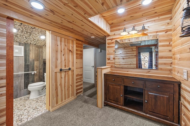 bathroom featuring recessed lighting, toilet, wood ceiling, wooden walls, and vanity