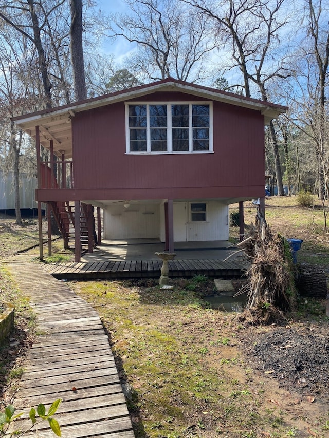 exterior space with stairs and a deck