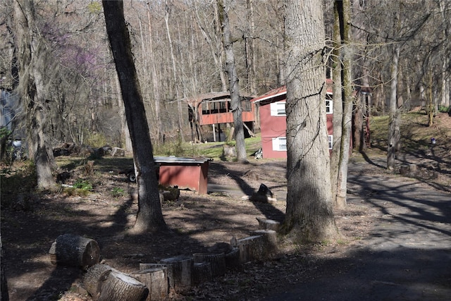 view of community with a wooded view