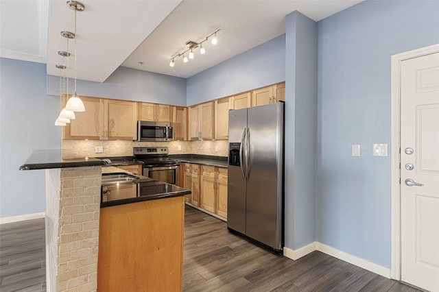 kitchen featuring a peninsula, appliances with stainless steel finishes, dark countertops, and light brown cabinetry