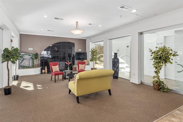 carpeted living room with baseboards, visible vents, crown molding, and recessed lighting