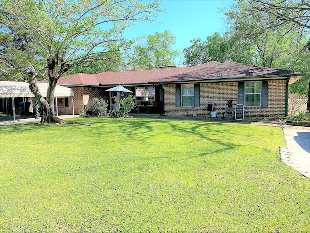 ranch-style house with a front lawn and brick siding