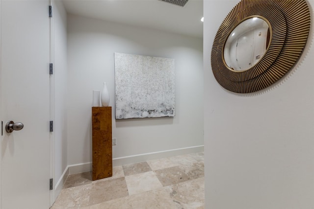 interior space featuring a heating unit and baseboards