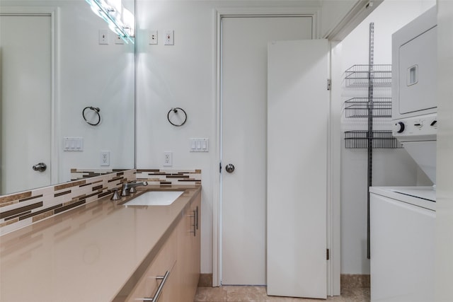 bathroom featuring vanity and decorative backsplash