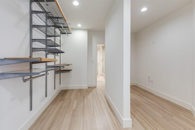 bar with light wood-style floors, recessed lighting, and baseboards