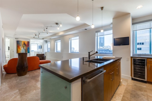 kitchen with dishwasher, beverage cooler, a tray ceiling, and a sink