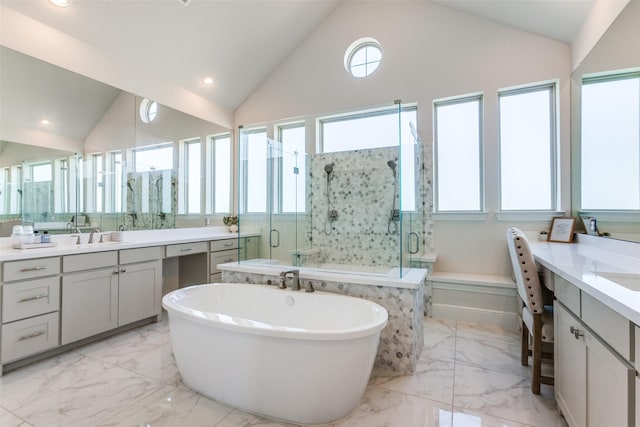 full bath with two vanities, recessed lighting, a stall shower, a freestanding bath, and marble finish floor