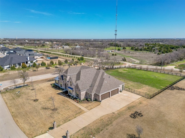 birds eye view of property featuring a rural view