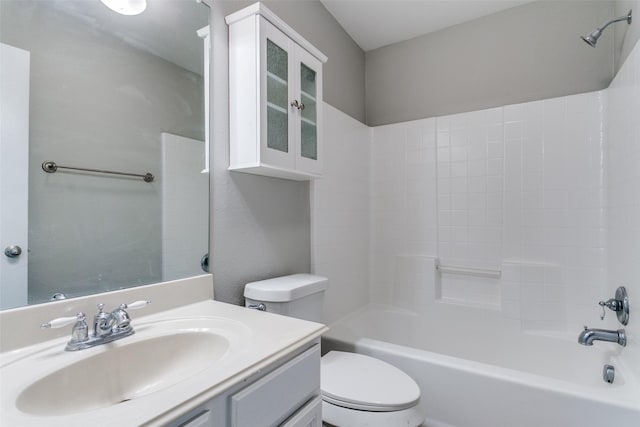 full bathroom featuring tub / shower combination, vanity, and toilet