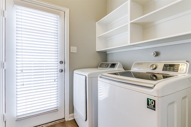 washroom featuring laundry area and washer and clothes dryer