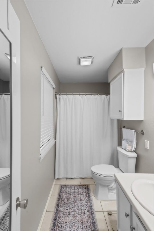 bathroom featuring toilet, tile patterned flooring, visible vents, and vanity