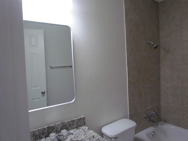 bathroom featuring toilet and shower / bathtub combination